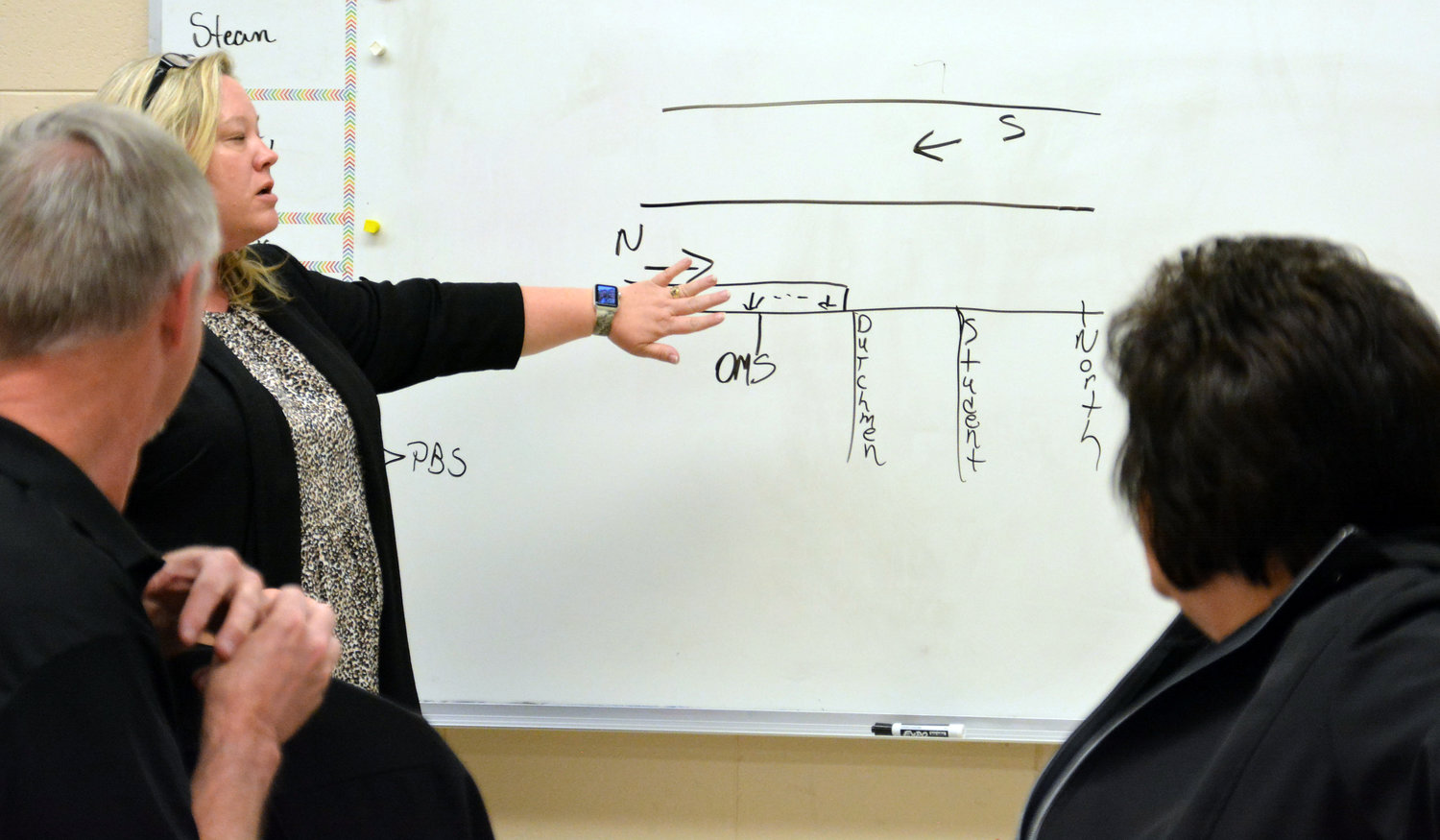 R-2 Superintendent Dr. Jeri Kay Hardy on Dec. 20 explains a diagram of entrances and exits at the district’s Owensville campus to Board of Education directors as they related to a city proposal to add turn lanes on Highway 19.